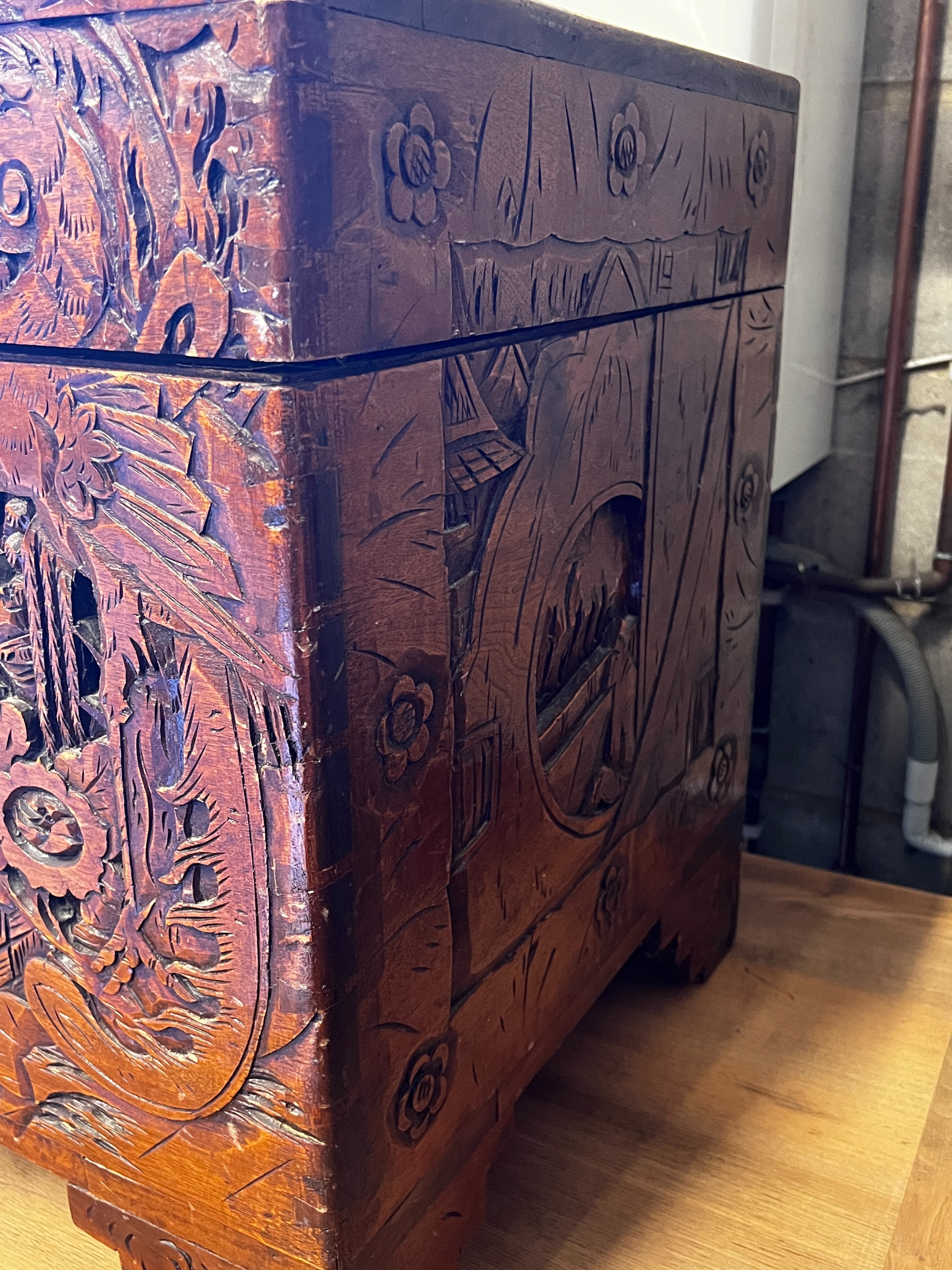 A Chinese carved camphorwood trunk, length 100cm, depth 50cm, height 60cm